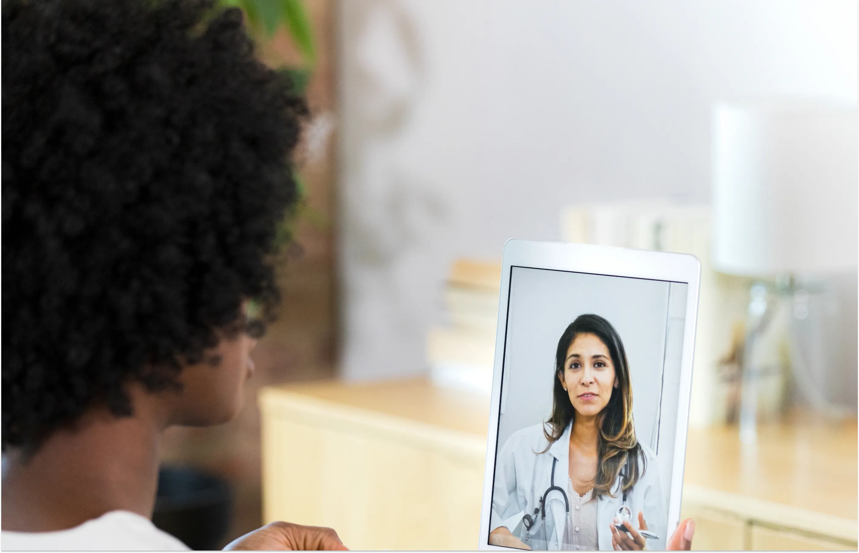 Female provider speaking with a patient through a virtual visit
