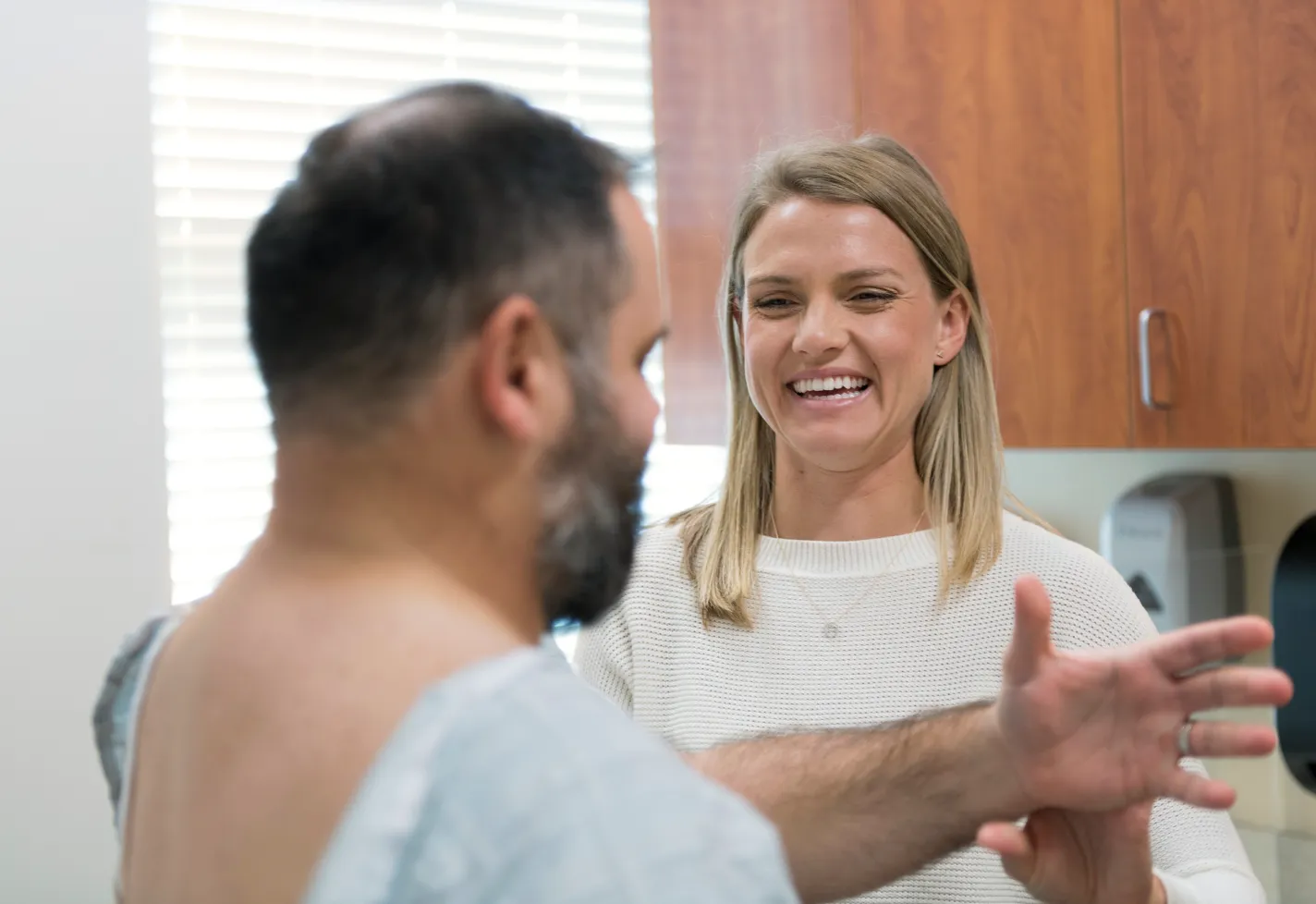 Novant Health's Doctor Jennifer Susanne Harvey treating patient's shoulder.
