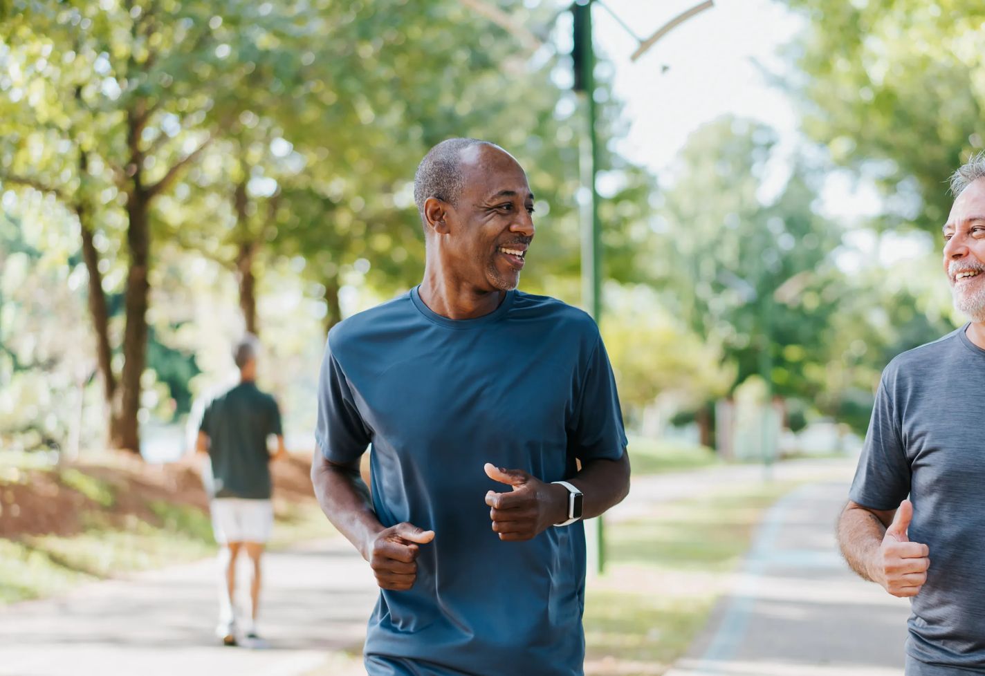 Two senior men jogging outdoors